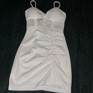 White dress with a see through mesh small slit on the side size: XS